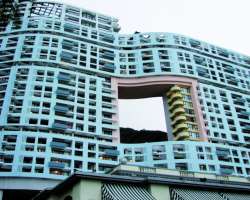 If you look around hard enough, you will find a bu If you look around hard enough, you will find a building with a hole in the middle. According to the belief in Feng-shui (chinese geomancy), such a d